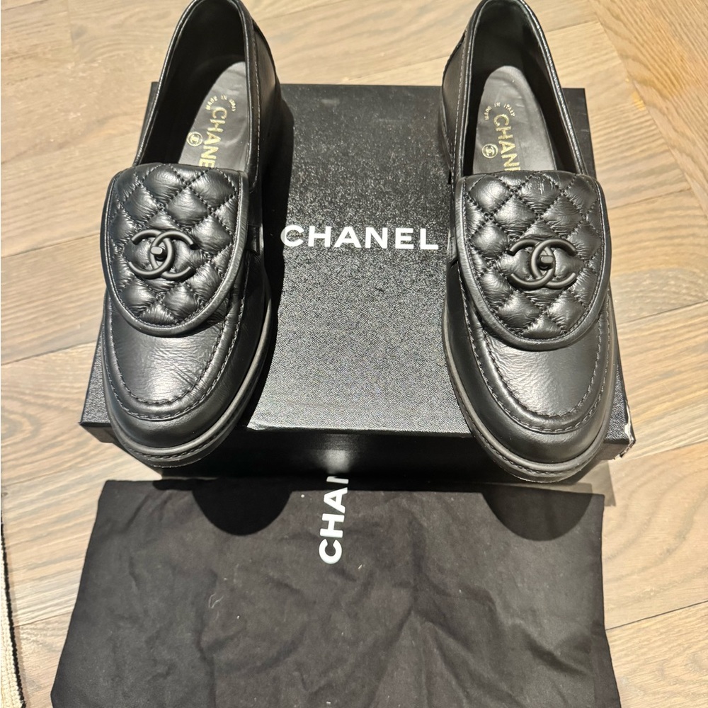 CHANEL quilted black loafers